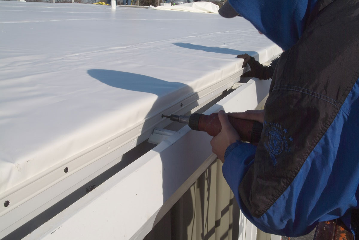 Man working on roof.